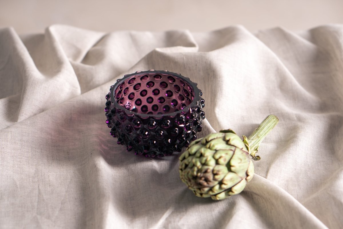 Violet Hobnail Bowl Small on a girs fabric with an artichoke